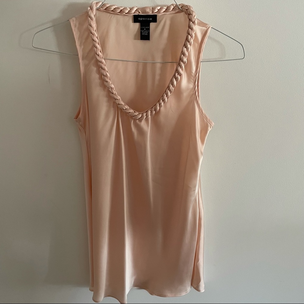 Sleeveless blouse with twisted neckline size small